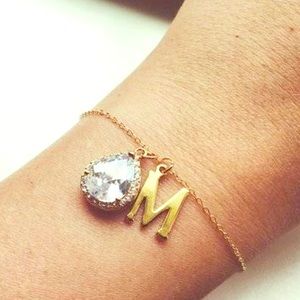 Gold bracelet 14 k with initial CZ pendant.